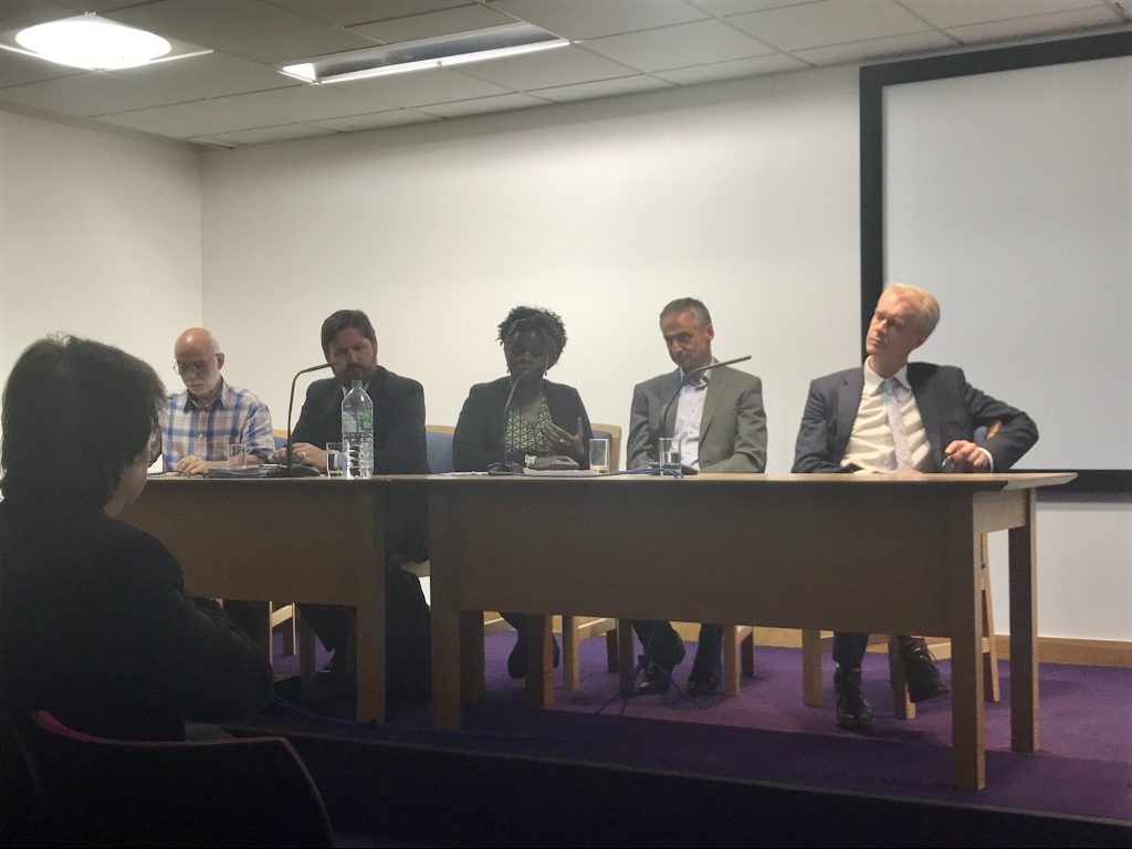 panel discussants at Refugee Week event (4 white males and one African female)
